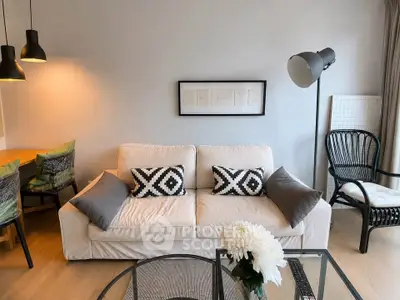 Stylish living room with modern decor, cozy sofa, and elegant lighting in a contemporary apartment.