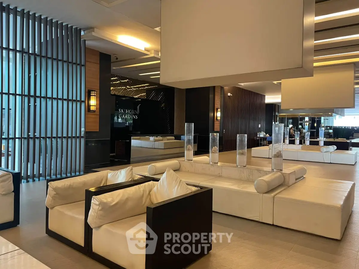 Luxurious modern lobby with elegant seating and ambient lighting in a high-end residential building.