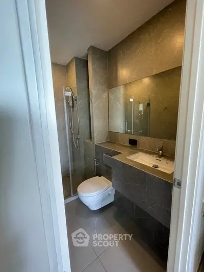 Modern bathroom with sleek design and glass shower enclosure
