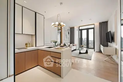 Modern open-plan kitchen and living room with city view, stylish decor, and natural light.