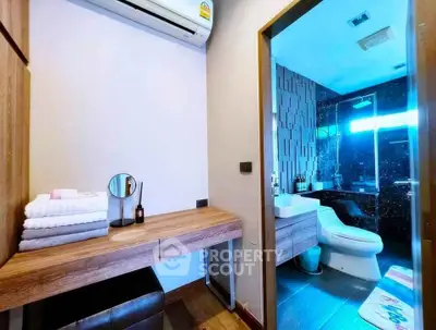 Modern bathroom with sleek design and wooden vanity in a stylish apartment.