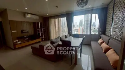 Spacious modern living room with city view and elegant furnishings