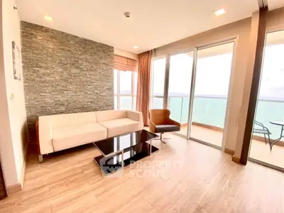 Spacious living room with ocean view and modern furnishings