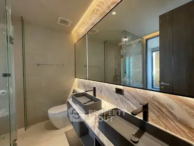 Luxurious modern bathroom with dual sinks and elegant marble accents