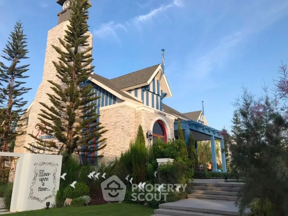 Charming rustic house with lush garden and blue sky backdrop