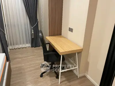 Modern study area with sleek desk and chair in cozy apartment