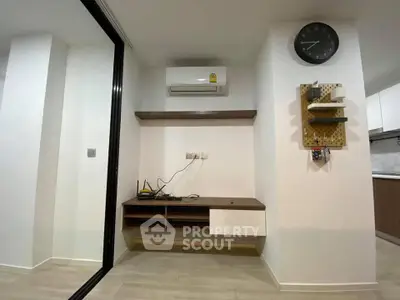 Modern interior with air conditioning and sleek shelving in a stylish apartment.