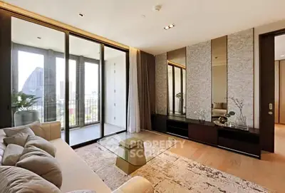 Luxurious living room with floor-to-ceiling windows and elegant decor in a modern apartment.