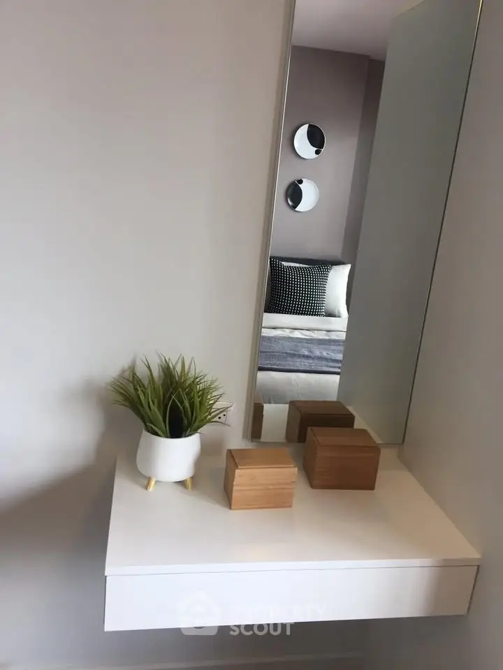 Modern bedroom with stylish decor and minimalist design elements.