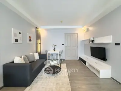 Modern living room with sleek furniture and stylish decor, perfect for contemporary urban living.