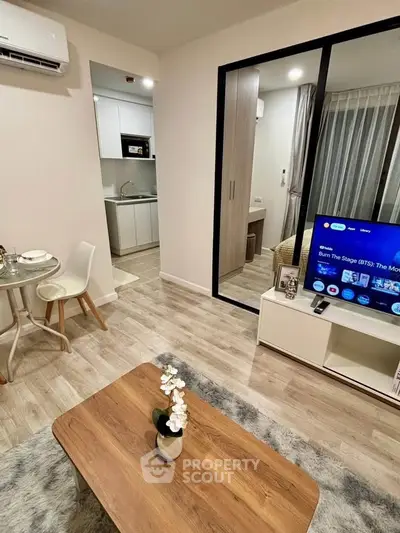 Modern living room with open kitchen and stylish decor