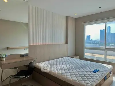 Modern bedroom with city view, featuring a stylish bed and workspace, ideal for urban living.