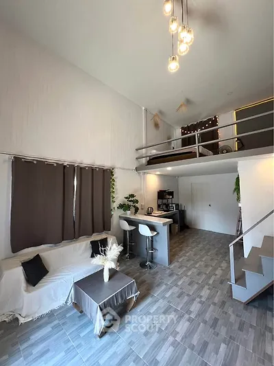 Modern loft apartment with open layout, stylish decor, and high ceilings, featuring a cozy living area and mezzanine.