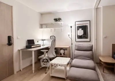 Modern study room with ergonomic chair, desk, and cozy seating in minimalist design.