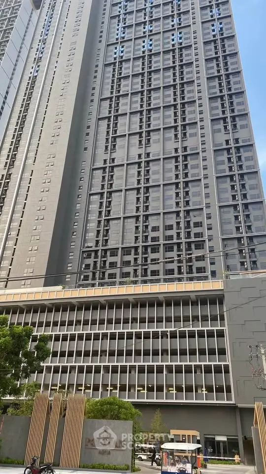 Modern high-rise building exterior with sleek design and urban appeal.