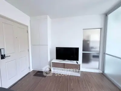 Modern living room with sleek TV stand and wooden flooring, perfect for contemporary living.