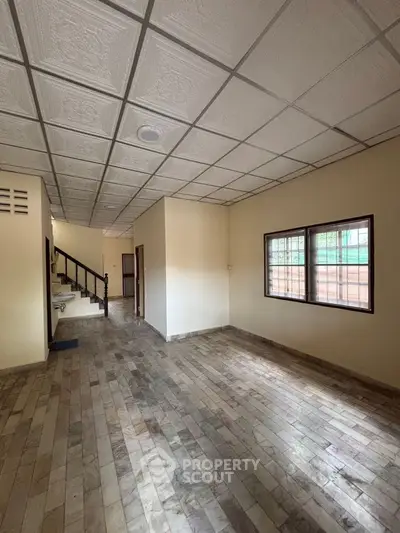 Spacious interior with tiled flooring and staircase in a modern home