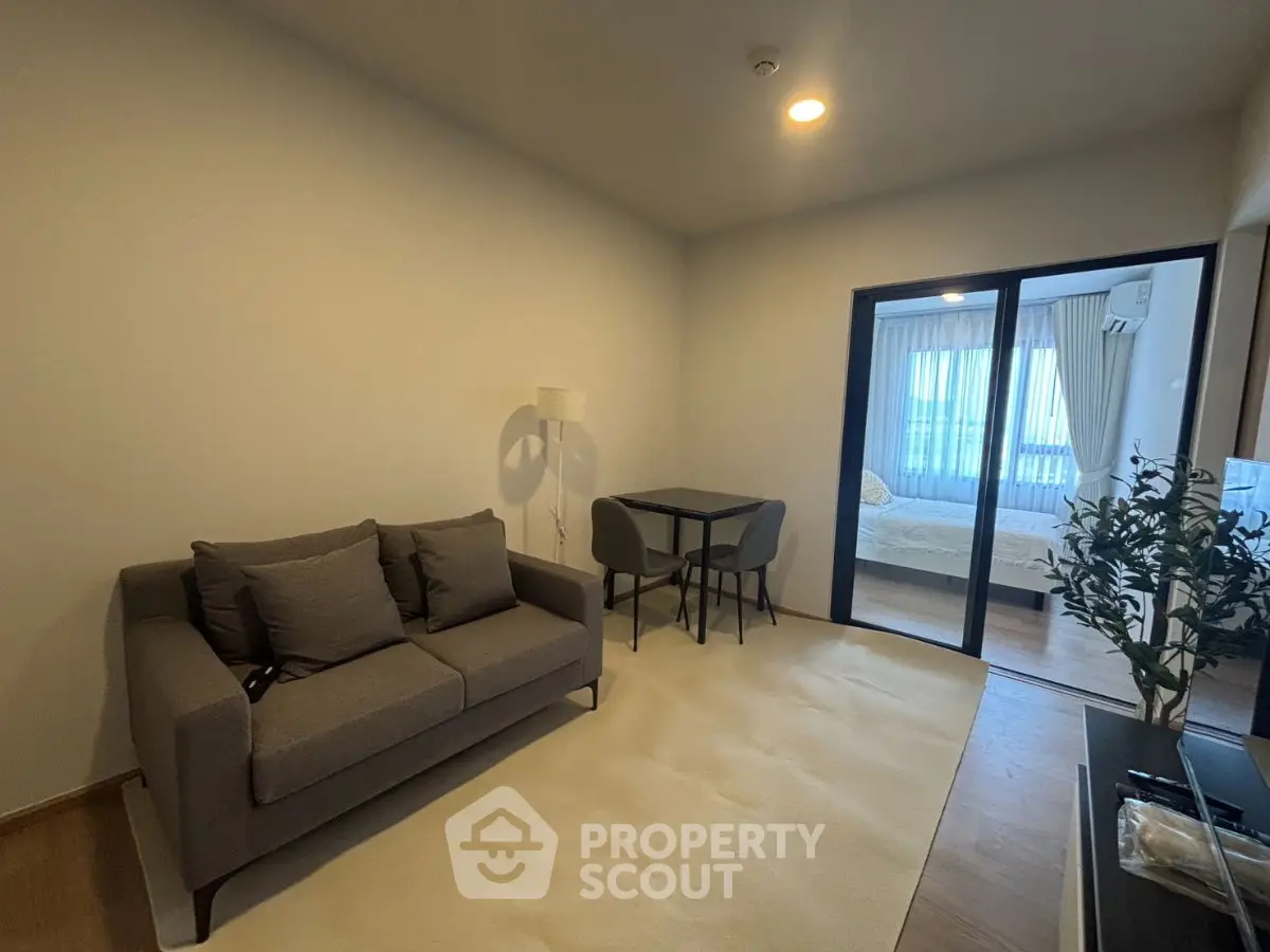 Modern living room with cozy sofa and dining area in stylish apartment