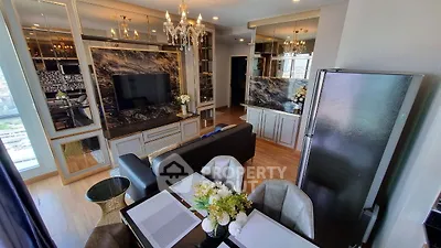 Luxurious living room with elegant decor and modern kitchen in open layout