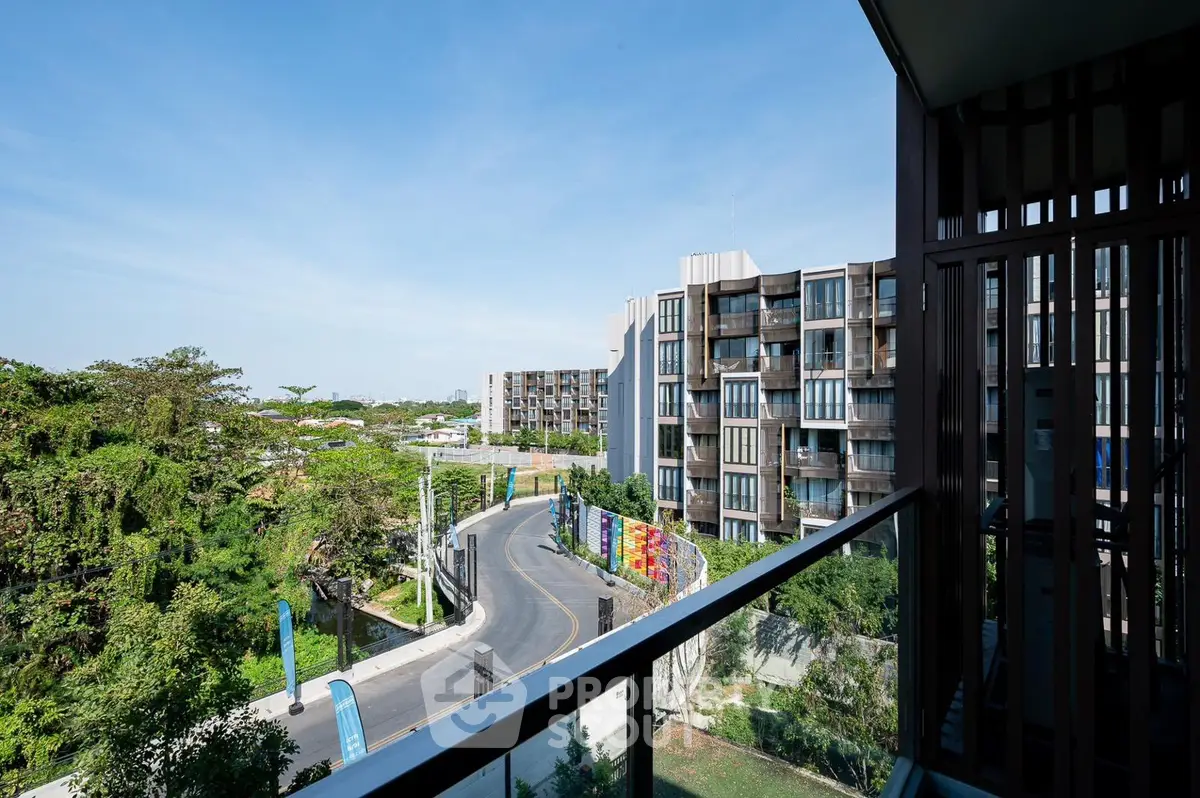Modern apartment building with scenic view from balcony