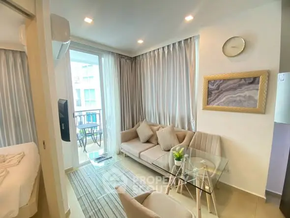 Modern living room with glass table and balcony view
