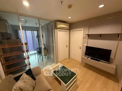 Modern living room with glass partition and stylish decor