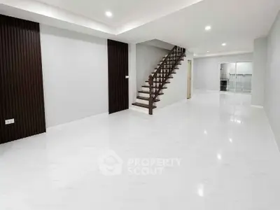 Spacious modern interior with sleek staircase and open layout