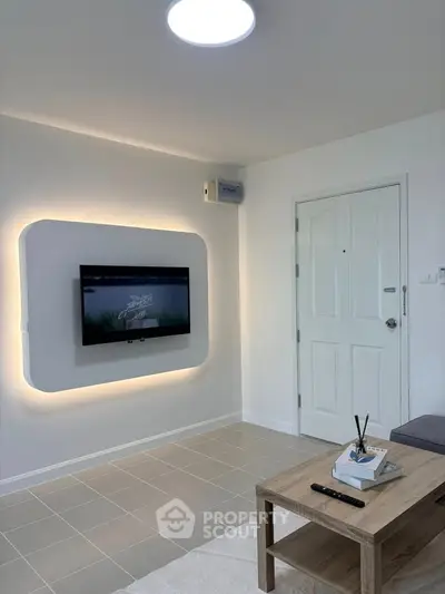 Modern living room with wall-mounted TV and stylish decor