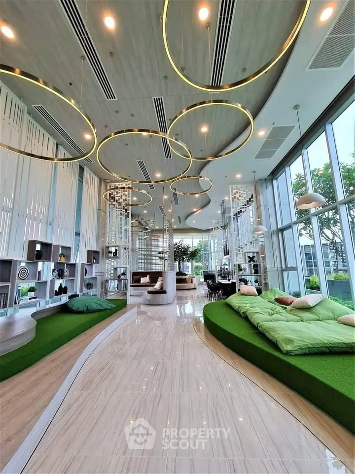 Luxurious modern living room with unique ceiling lights and large windows offering a stunning view.