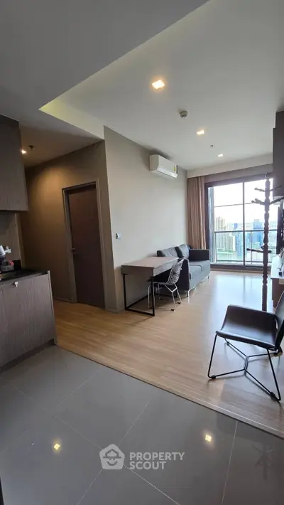 Modern living room with balcony view in stylish apartment