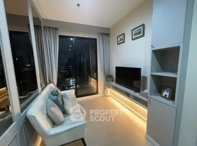 Modern living room with sleek design, featuring a cozy sofa, wall-mounted TV, and ambient lighting.