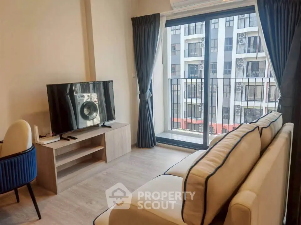 Modern living room with balcony view in urban apartment