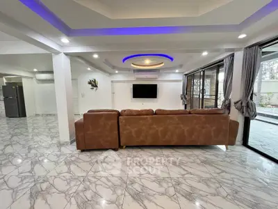 Spacious modern living room with marble floors and stylish lighting