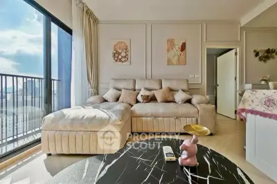 Luxurious living room with plush sofa and city view balcony, perfect for relaxation and entertaining.