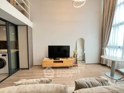 Modern living room with high ceiling and stylish decor