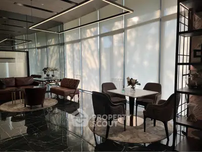 Luxurious modern living room with elegant furniture and floor-to-ceiling windows