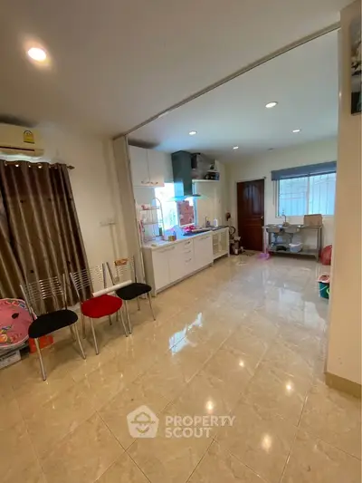 Spacious open layout kitchen with modern appliances and ample natural light.