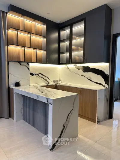 Luxurious modern kitchen with marble countertops and elegant cabinetry