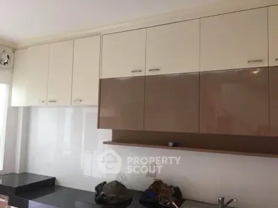 Modern kitchen with sleek cabinetry and ample storage space