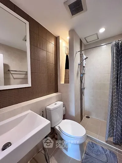 Modern bathroom with sleek fixtures and stylish tile design