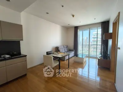 Modern living room with open kitchen and city view balcony