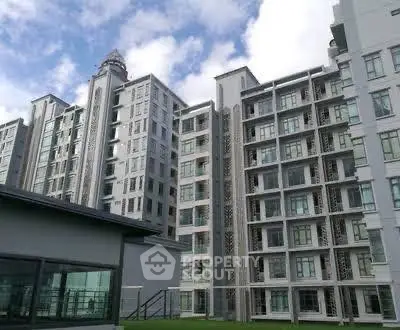 Modern high-rise residential building with contemporary architecture and large windows