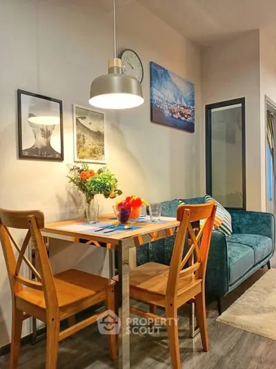 Cozy dining area with modern decor and vibrant seating in a stylish apartment.