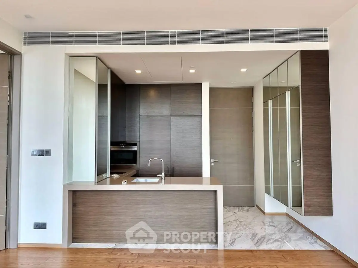 Modern kitchen with sleek design and open layout in luxury apartment