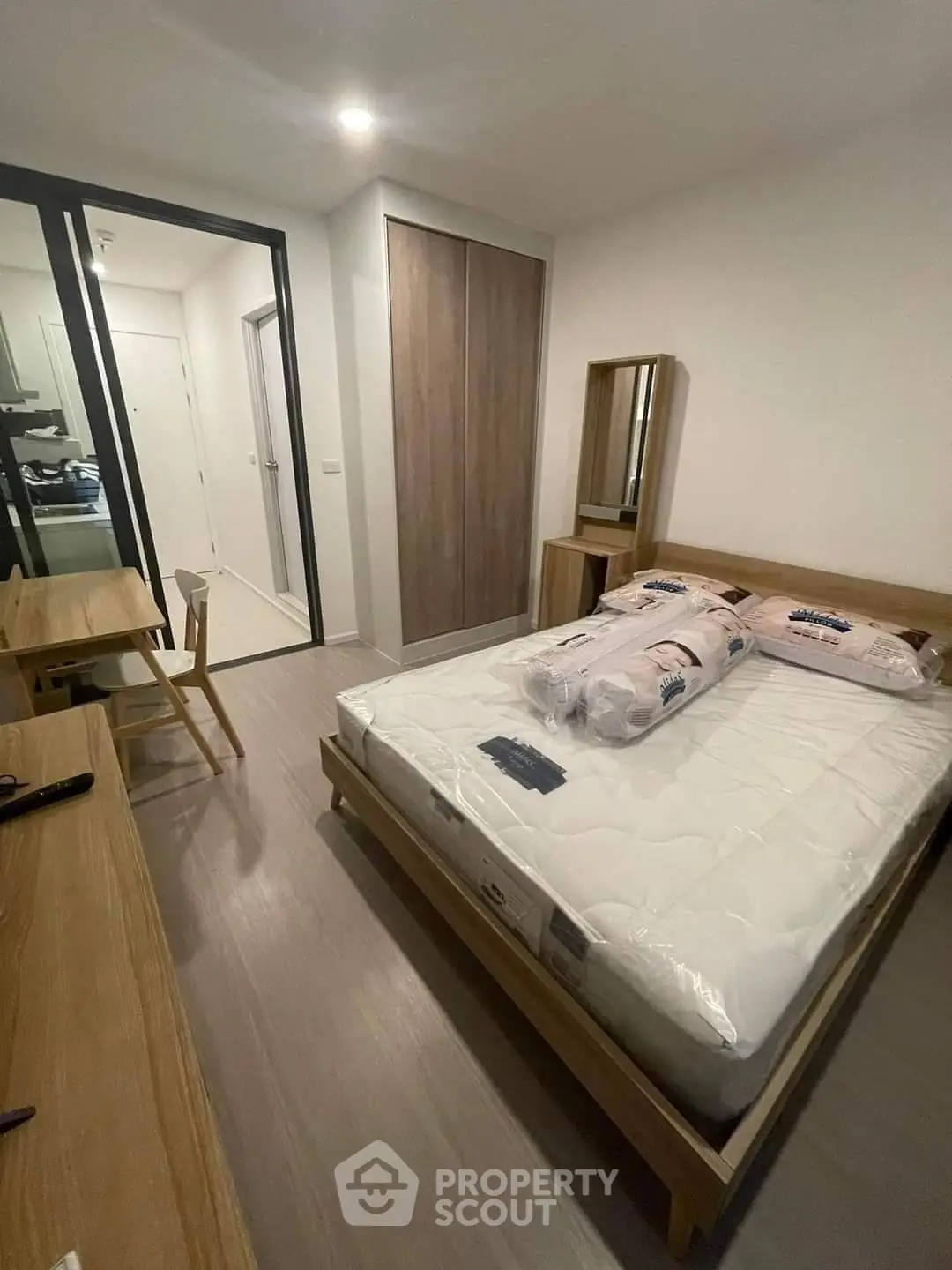 Modern bedroom with wooden furniture and cozy ambiance