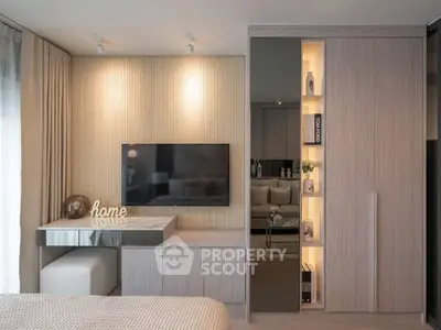 Modern bedroom with sleek TV setup and stylish decor