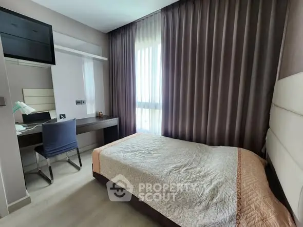 Cozy bedroom with modern decor and natural light