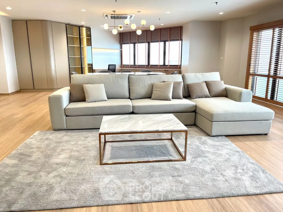Spacious modern living room with elegant sofa and natural light