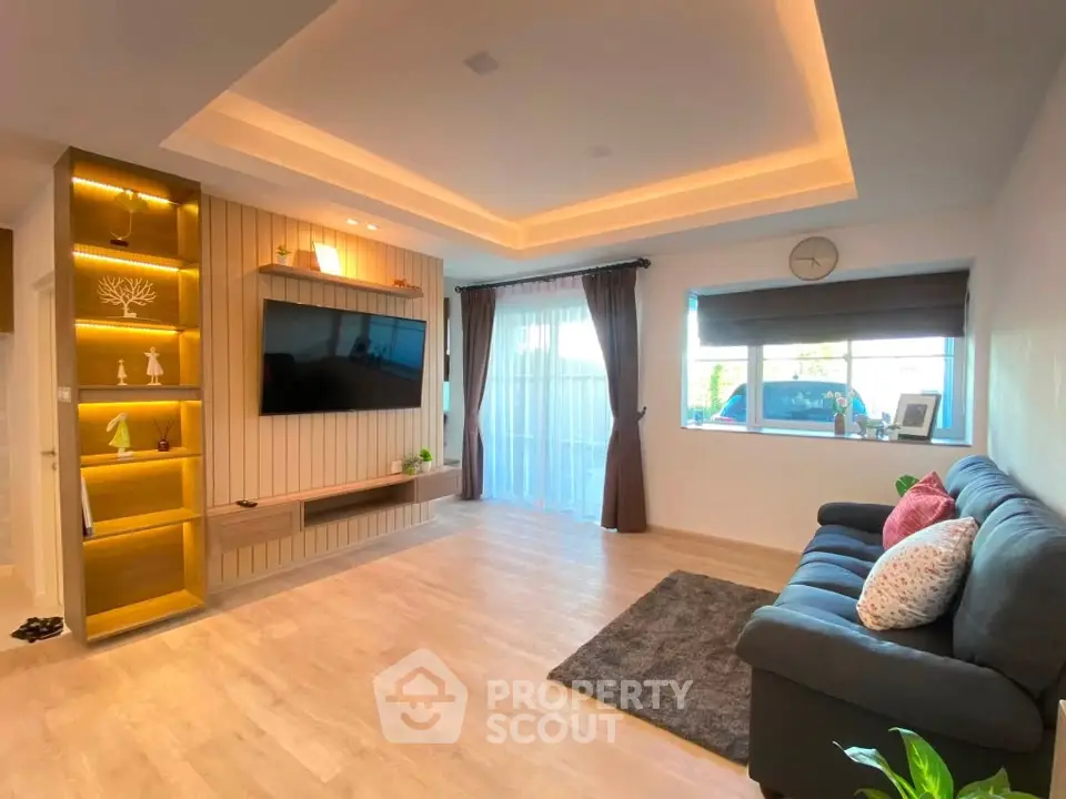 Spacious modern living room with elegant lighting and stylish decor