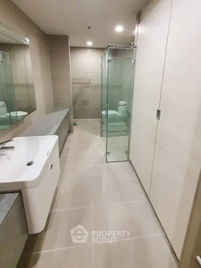 Modern bathroom with sleek design and glass shower enclosure